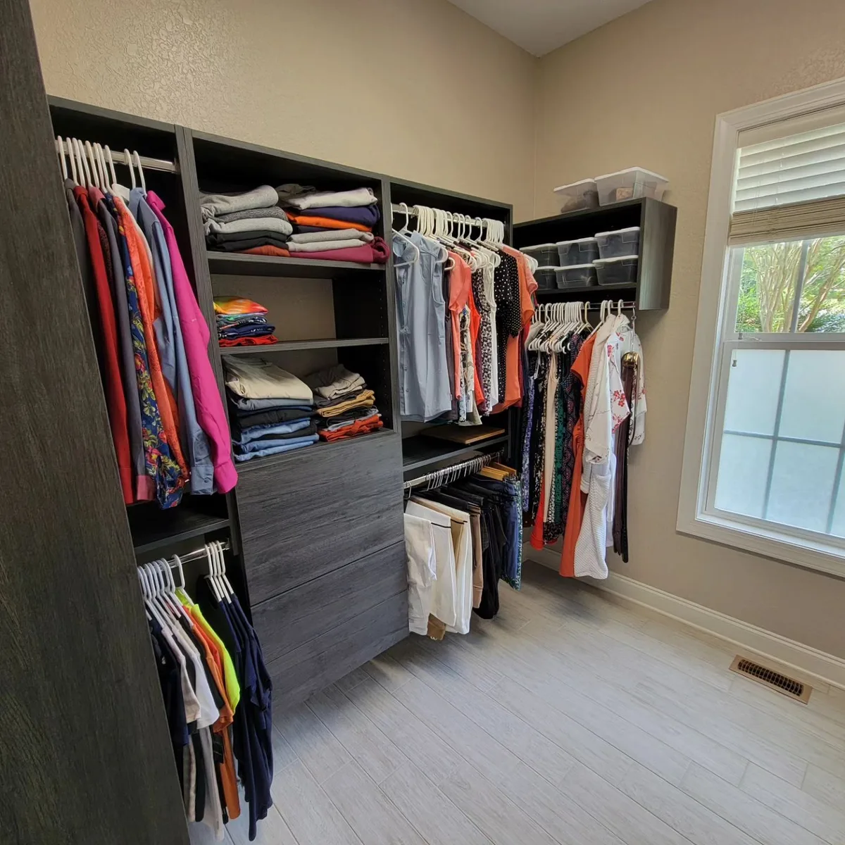 Walk-in closet with gray laminate finish