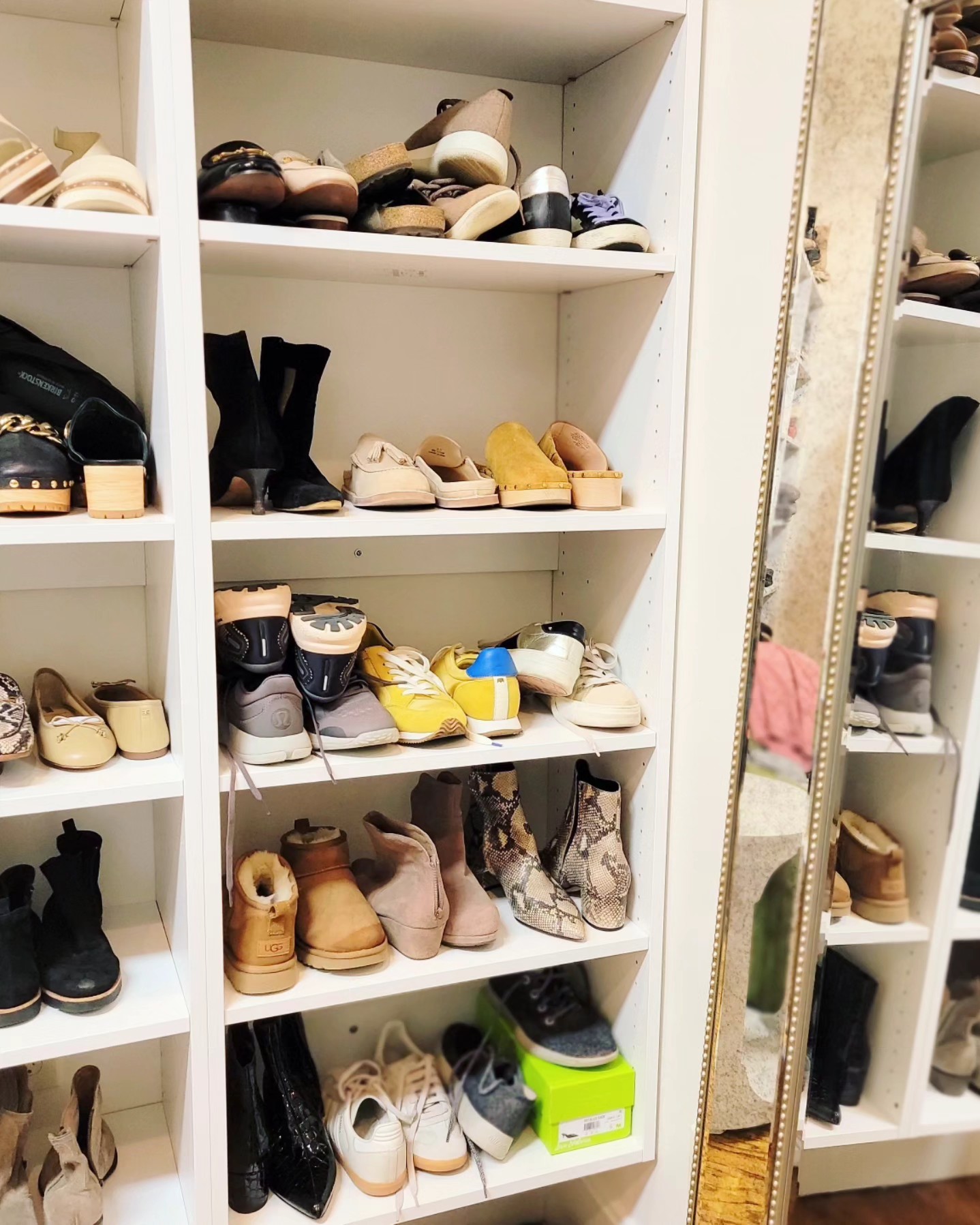 Walk-in closet shoe storage with mirror