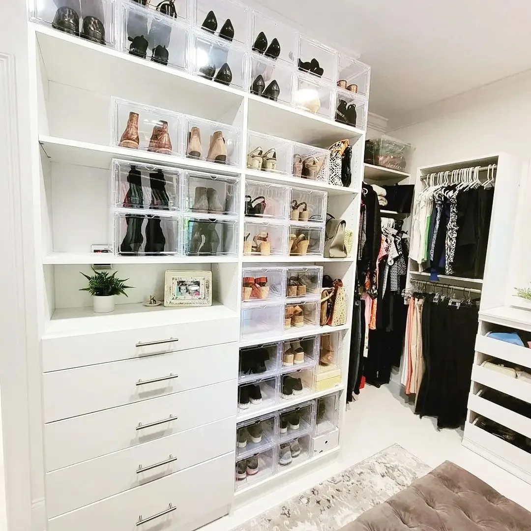 Walk-in closet with shoe storage boxes and drawers