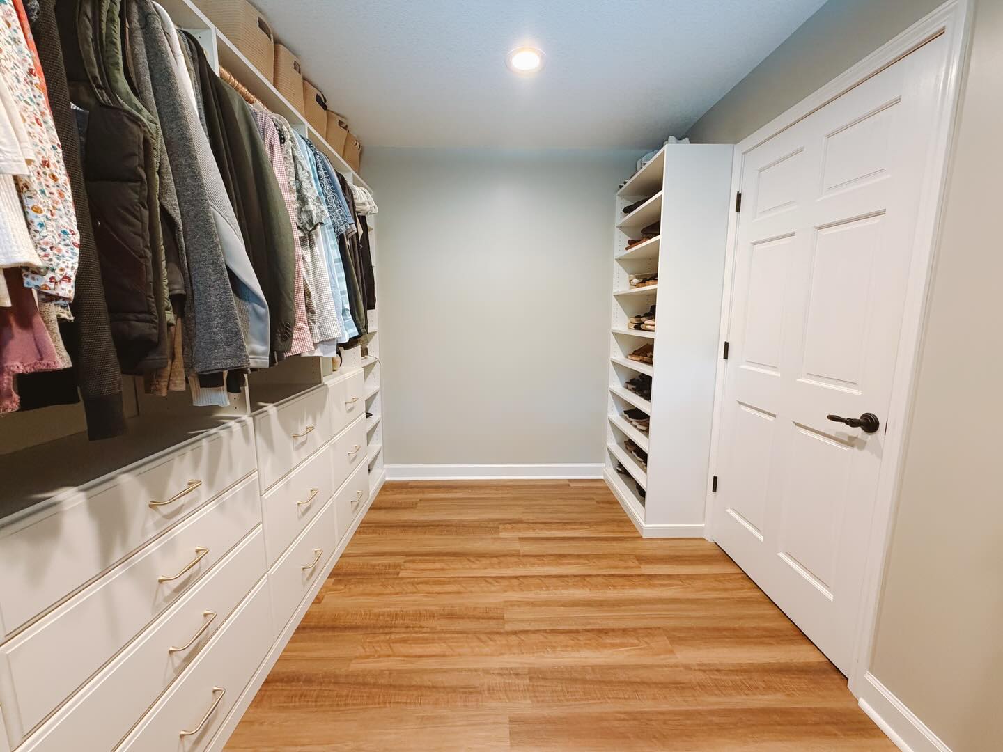 Walk-in closet with shoe tower and drawers