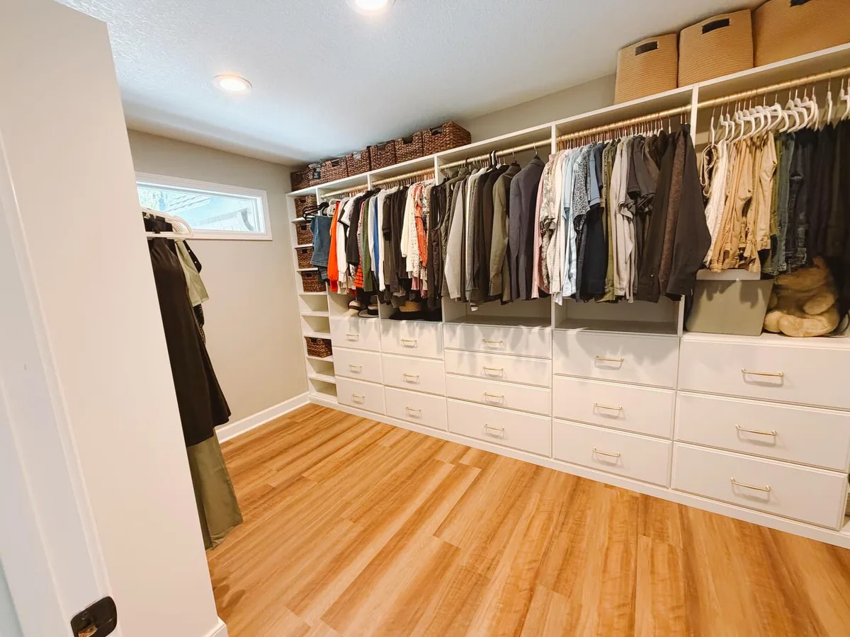 Walk-in closet with wide view of drawers and hanging space